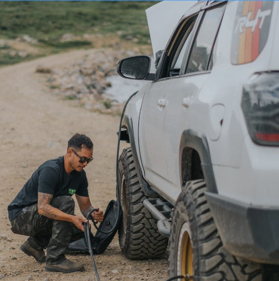 man beside a truck