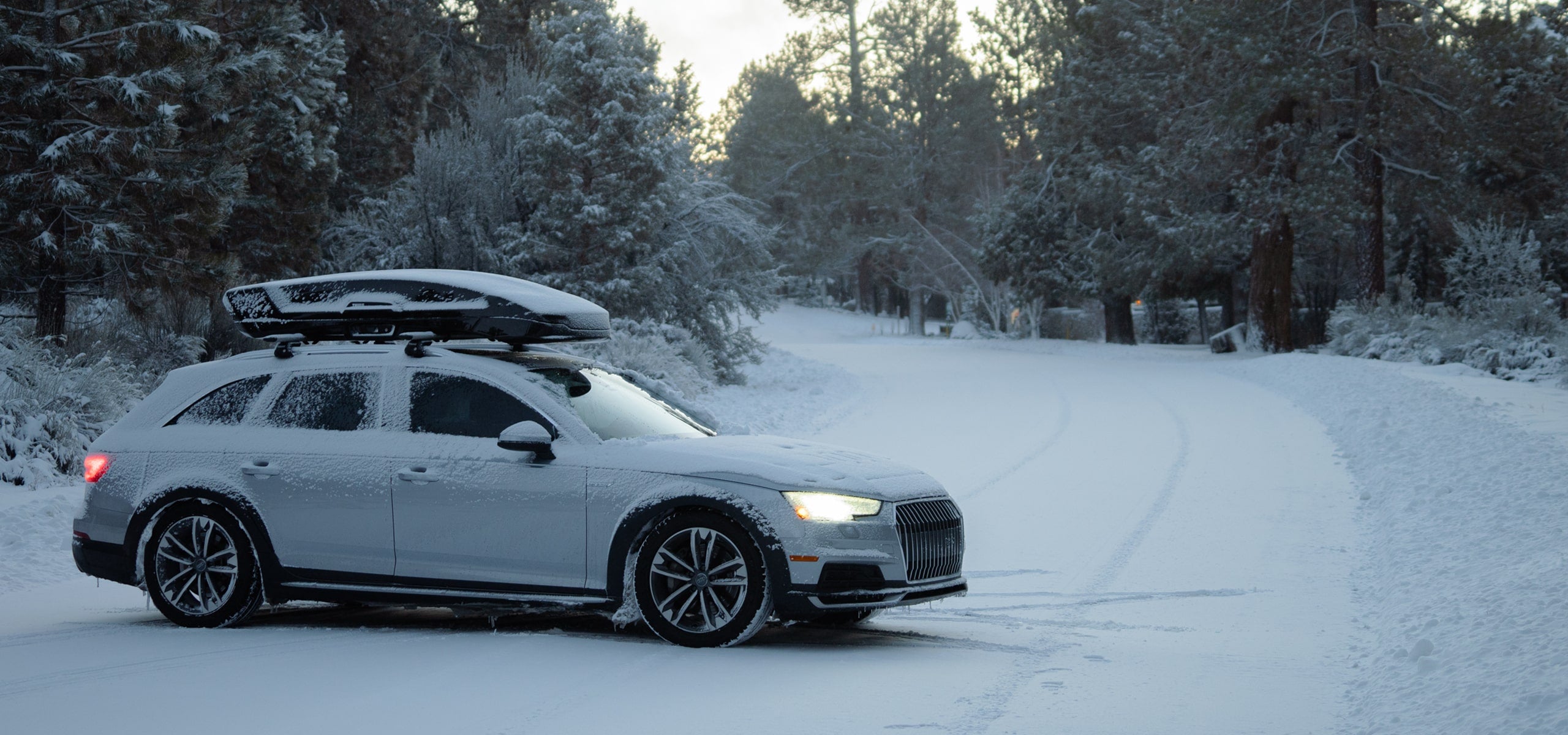 a car in the winter standing on the snow covered road