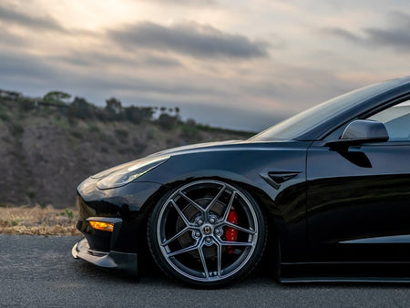 black car front with a tire