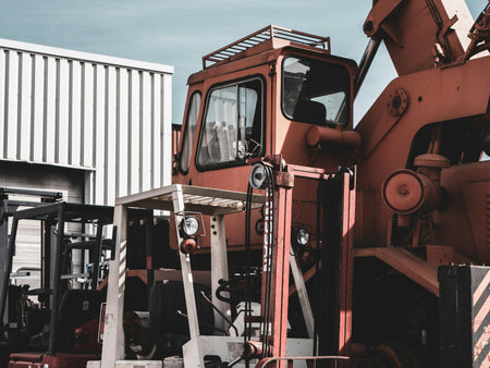 industrial machinery in front of a storage facility